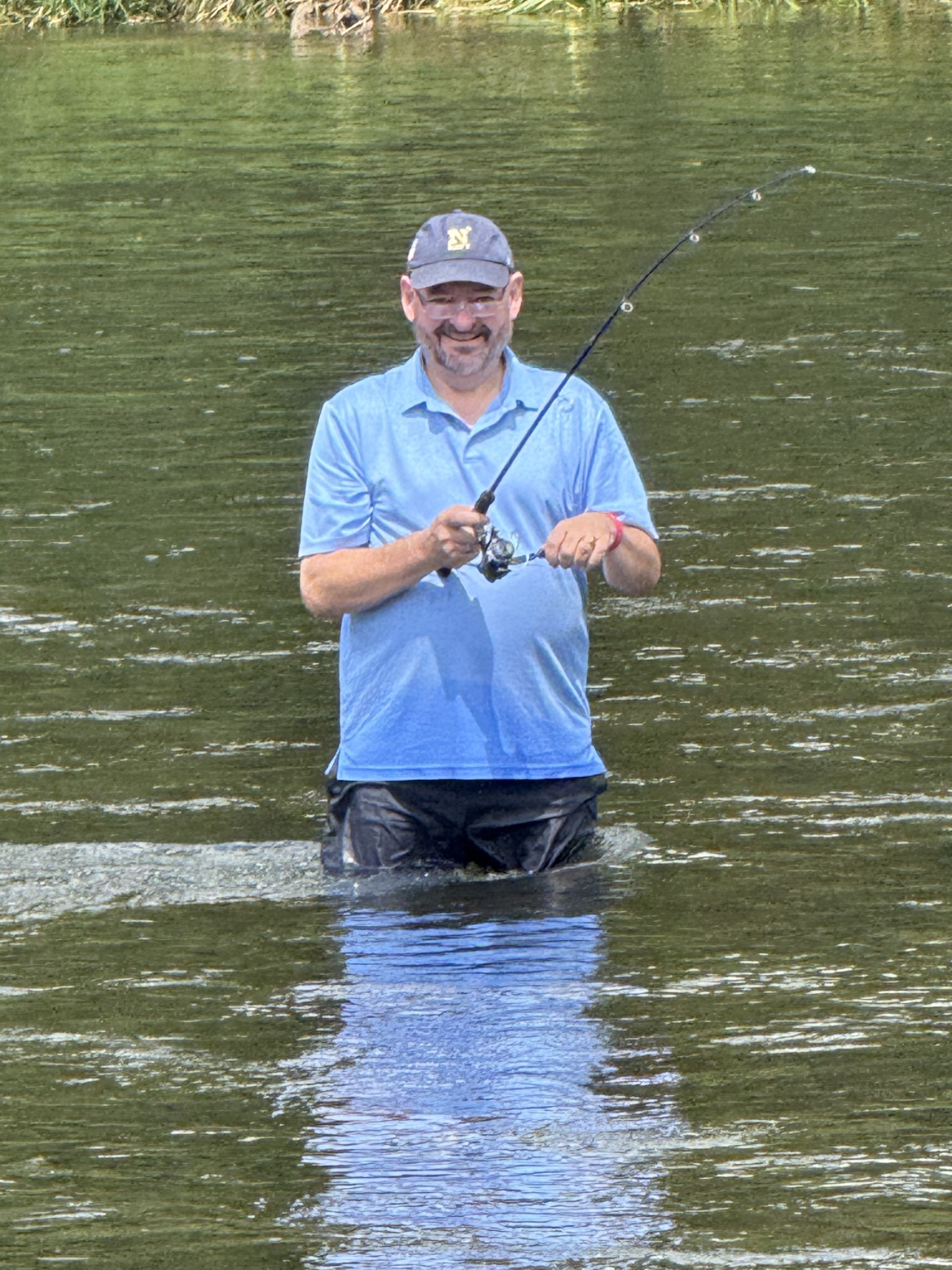 Bruce wading the Watauga in a Navy hat